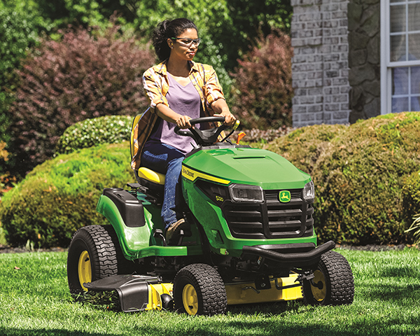 A 200 Series John Deere Lawn Tractor mowing the yard